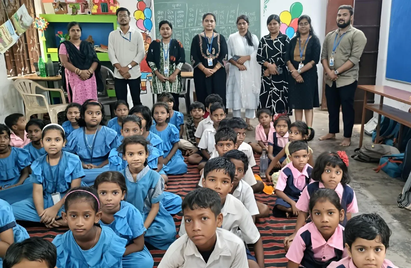 JYS volunteers with students at a school awareness session
